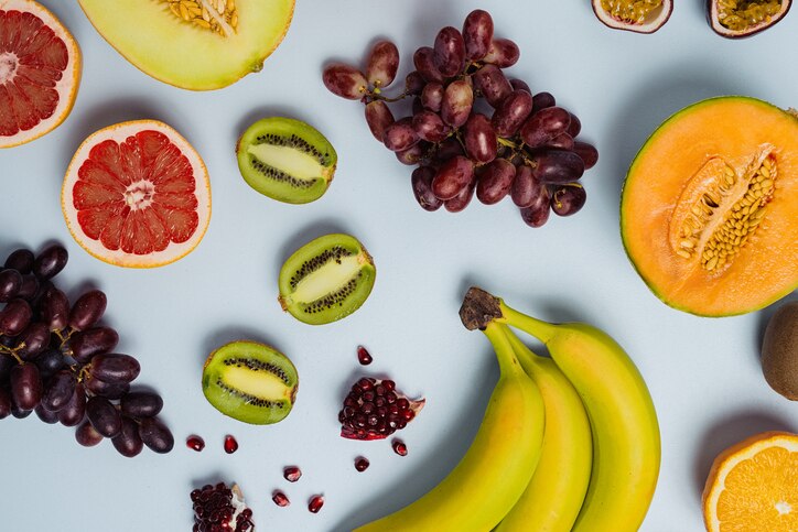 Fruit flat lay from above colorful food background